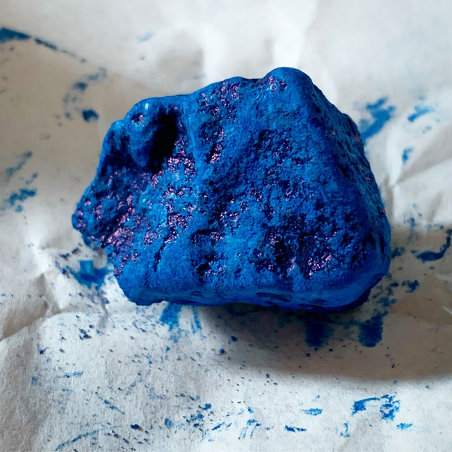 indigo blue pigment, like a rock